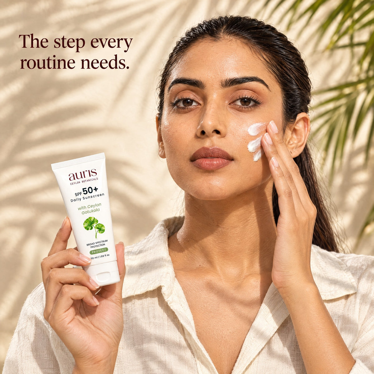 Auris SPF 50+ Daily Sunscreen: worn in a warm editorial portrait