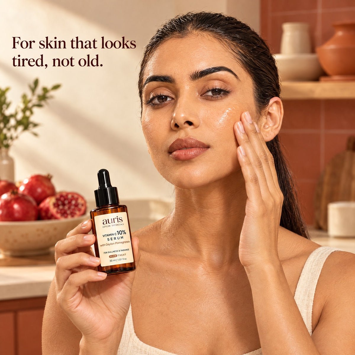 Auris GLOW Vitamin C 10% Serum: worn in a warm editorial portrait