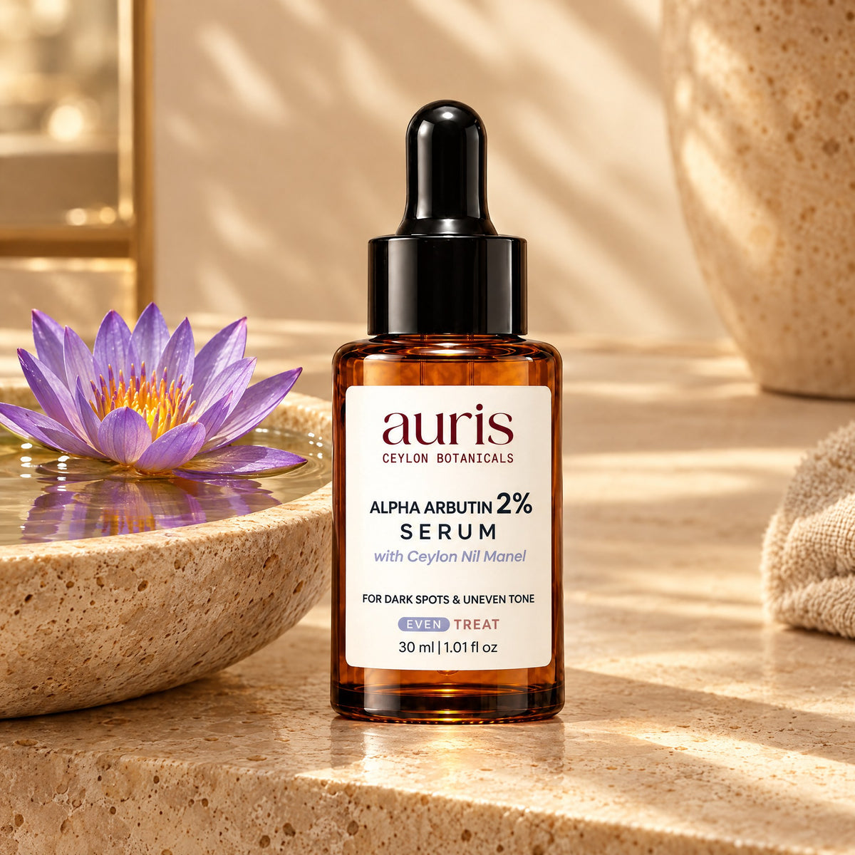 Auris EVEN Alpha Arbutin 2% Serum on a vanity with its Ceylon botanical