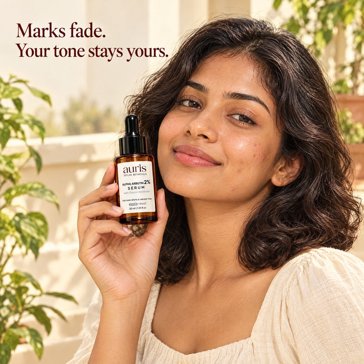OLD (restored for review) — Auris EVEN Alpha Arbutin 2% Serum: worn in a warm editorial portrait