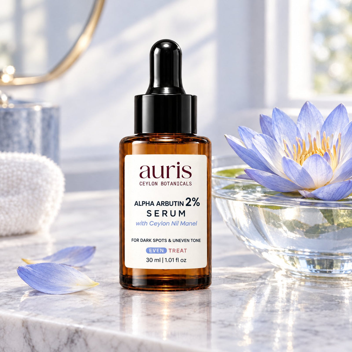 OLD (restored for review) — Auris EVEN Alpha Arbutin 2% Serum on a vanity with its Ceylon botanical