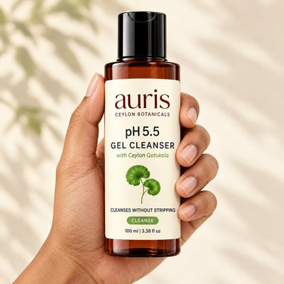 Auris pH 5.5 Gel Cleanser held in hand, label facing the camera