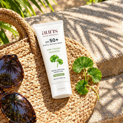 Auris SPF 50+ Daily Sunscreen on a vanity with its Ceylon botanical