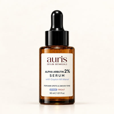 Auris EVEN Alpha Arbutin 2% Serum with Ceylon Nil Manel, 30 ml amber dropper bottle on a white background