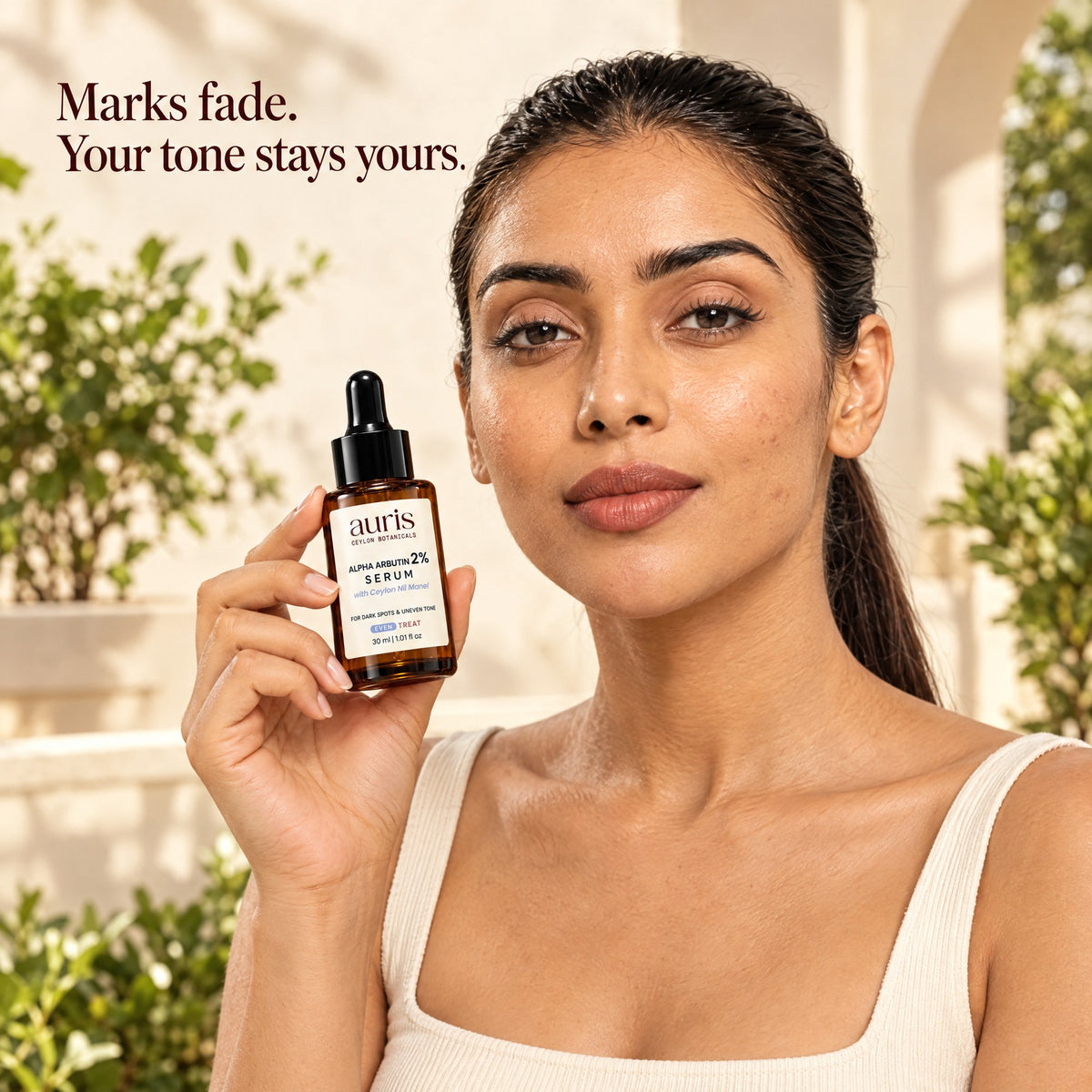 Auris EVEN Alpha Arbutin 2% Serum: worn in a warm editorial portrait