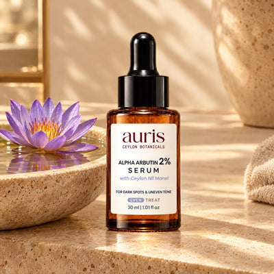Auris EVEN Alpha Arbutin 2% Serum on a vanity with its Ceylon botanical