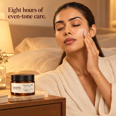 Auris EVEN Alpha Arbutin 1% Night Cream: worn in a warm editorial portrait