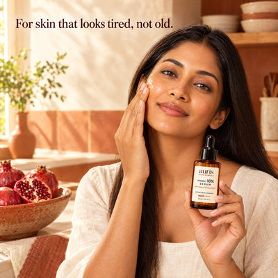 OLD (restored for review) — Auris GLOW Vitamin C 10% Serum: worn in a warm editorial portrait