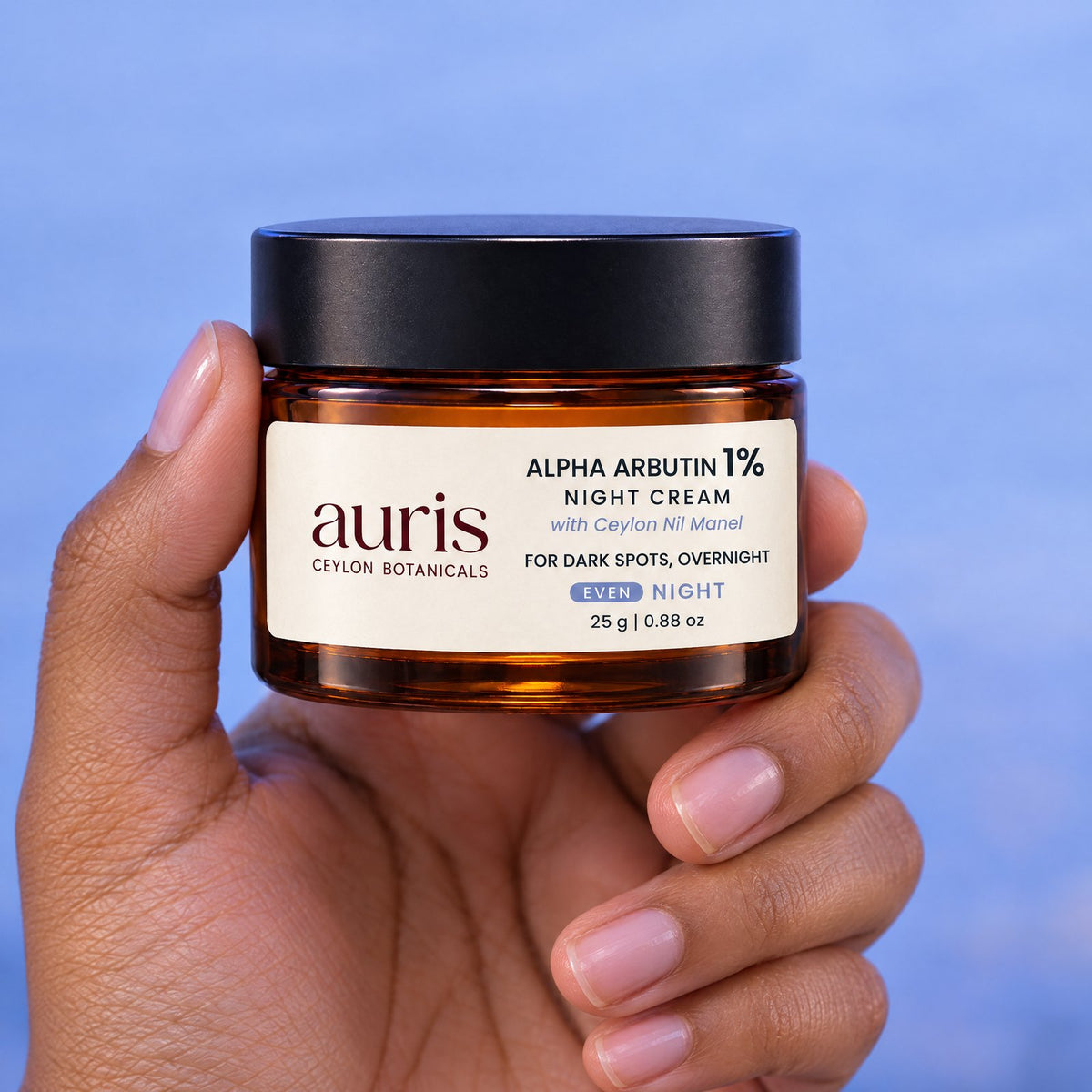 OLD (restored for review) — Auris EVEN Alpha Arbutin 1% Night Cream held in hand, label facing the camera